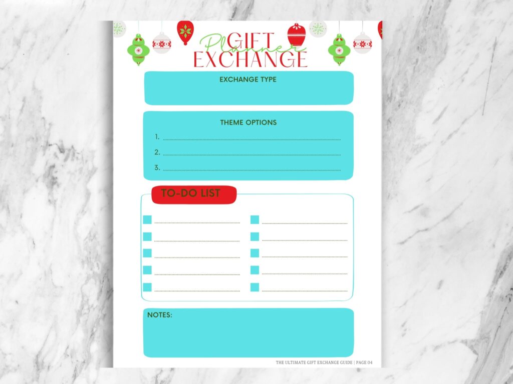 A granite counter with a colorful blue, red and green page that says Gift Exchange Planner